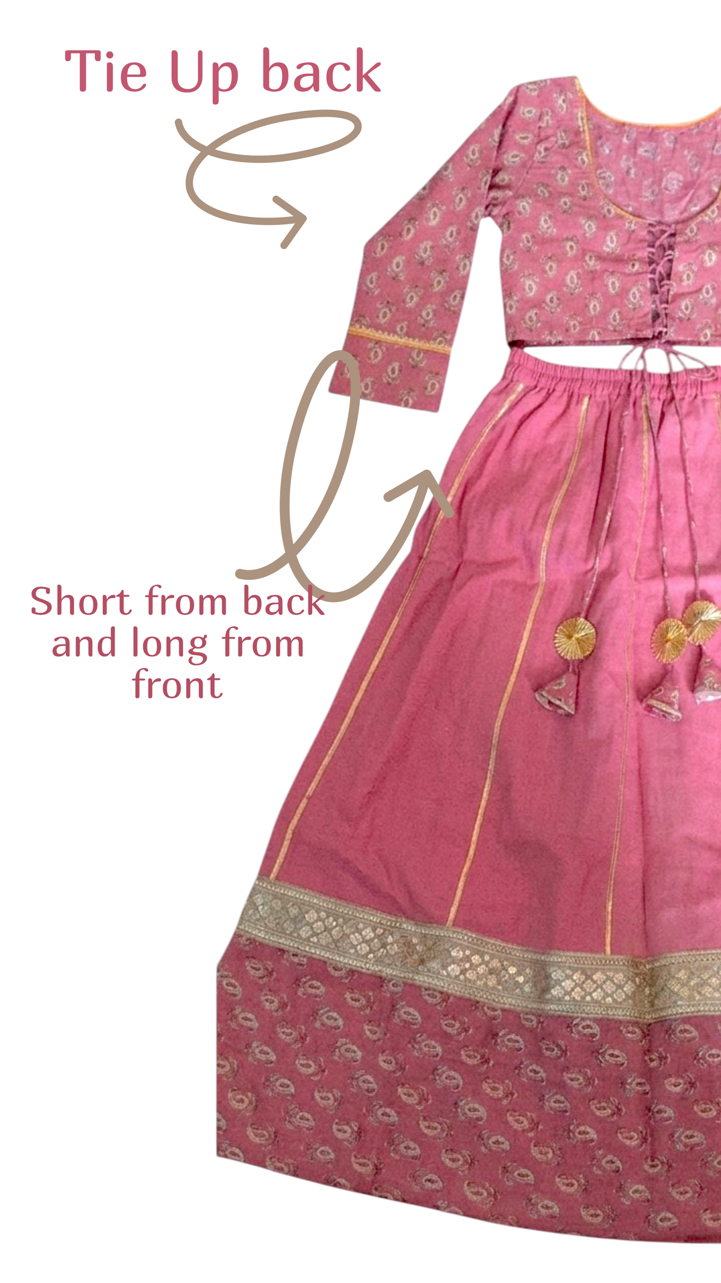 A pink traditional outfit with a patterned long kurta and matching skirt, shown on a white background with arrows and text explaining how to tie it up from the back. The kurta has gold trim and tassel details.