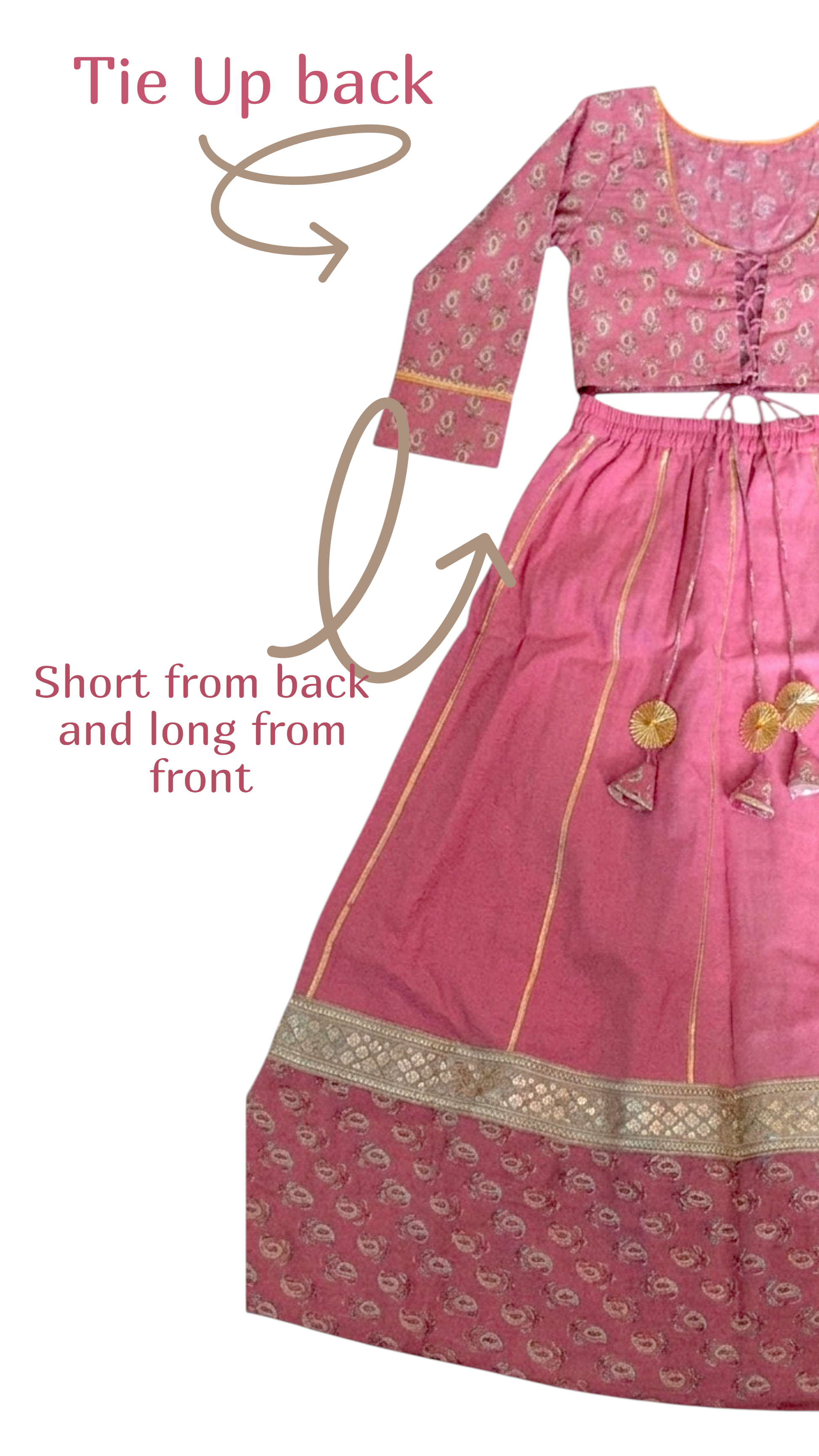 A pink traditional outfit with a patterned long kurta and matching skirt, shown on a white background with arrows and text explaining how to tie it up from the back. The kurta has gold trim and tassel details.