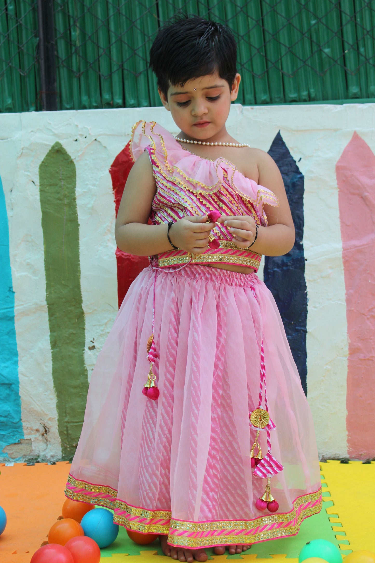 Pink off shoulder leheriya lehenga