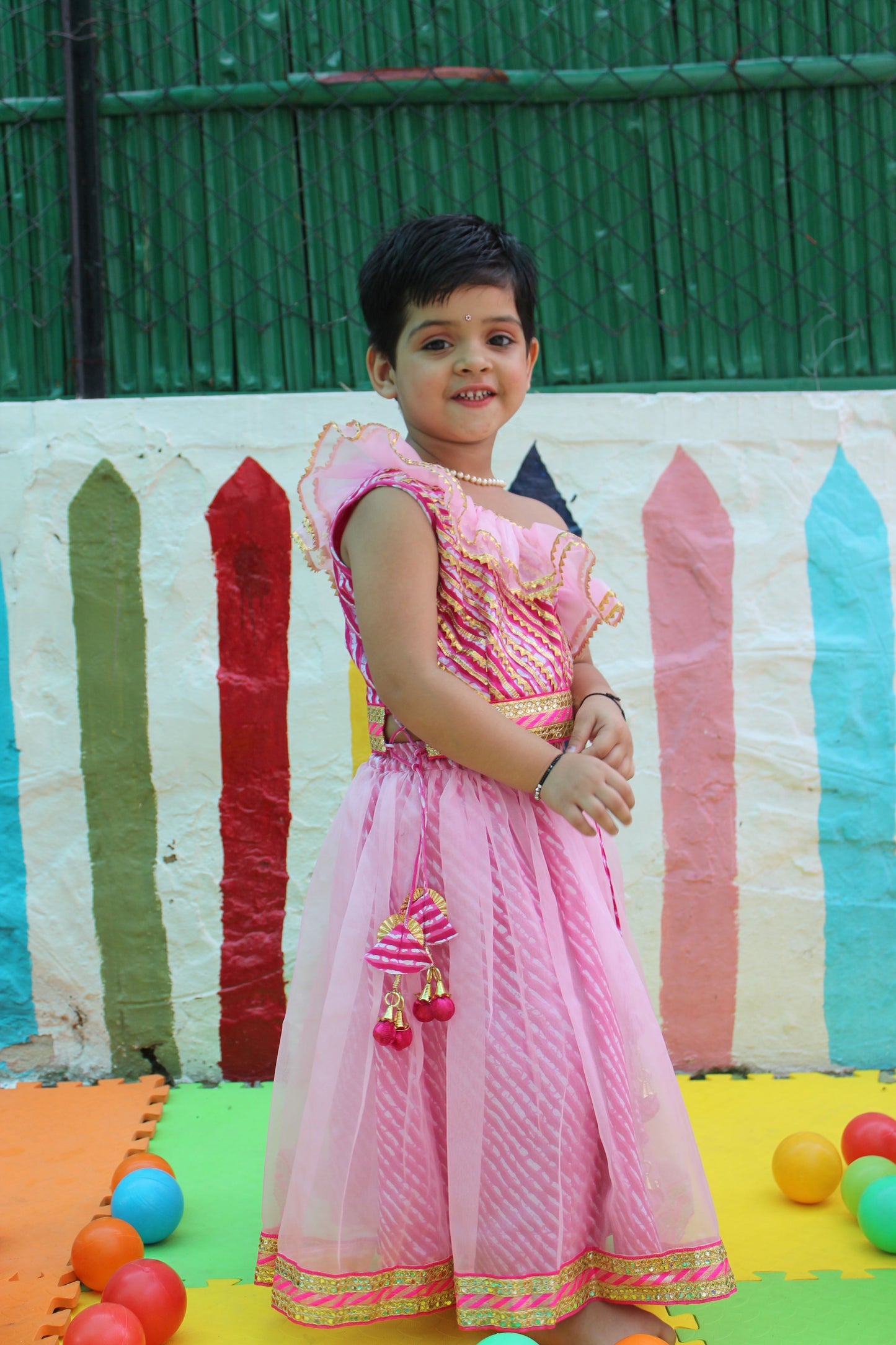 Pink off shoulder leheriya lehenga