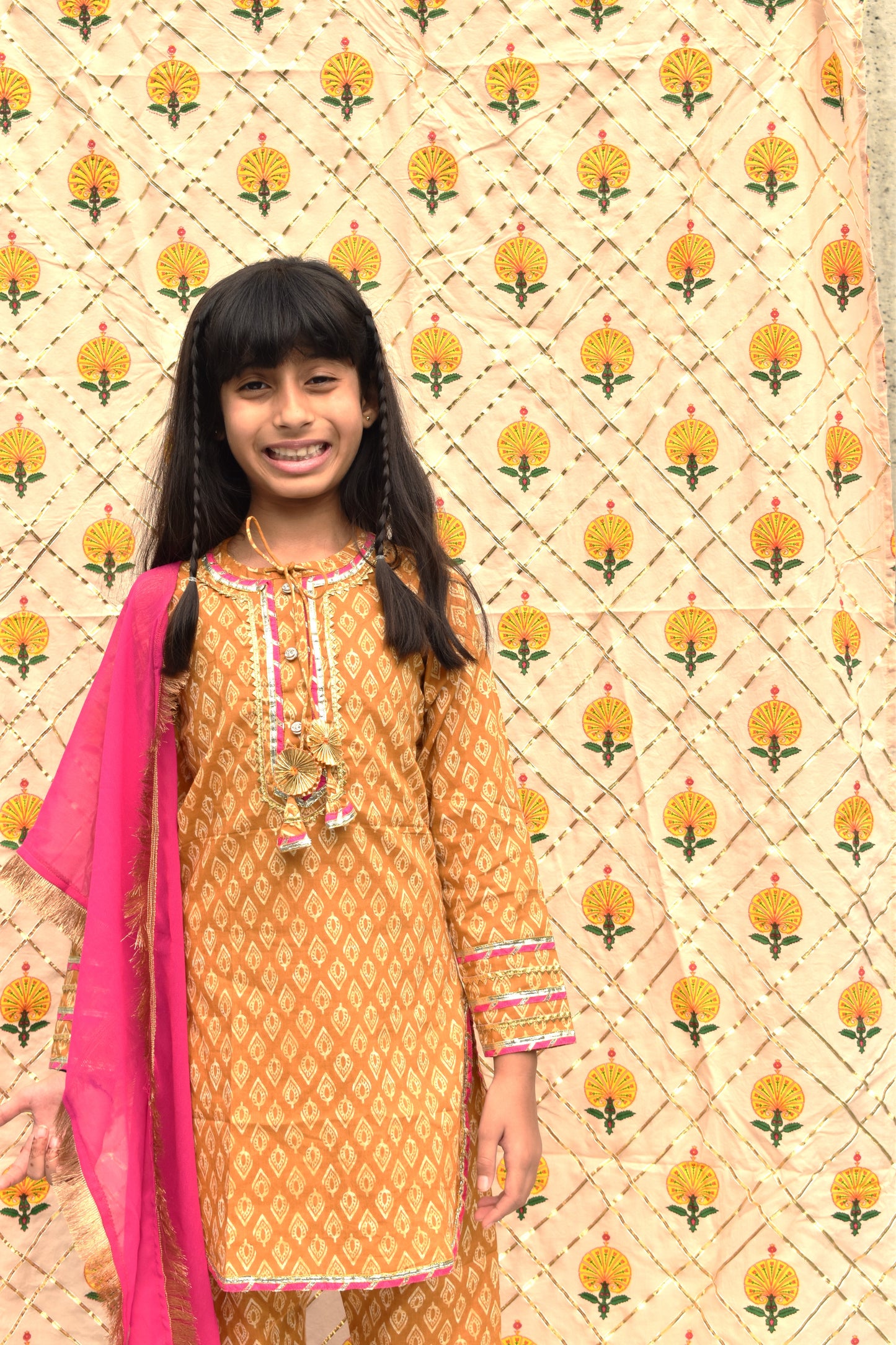 Peet : Mustard printed suit with Pink dupatta for girls