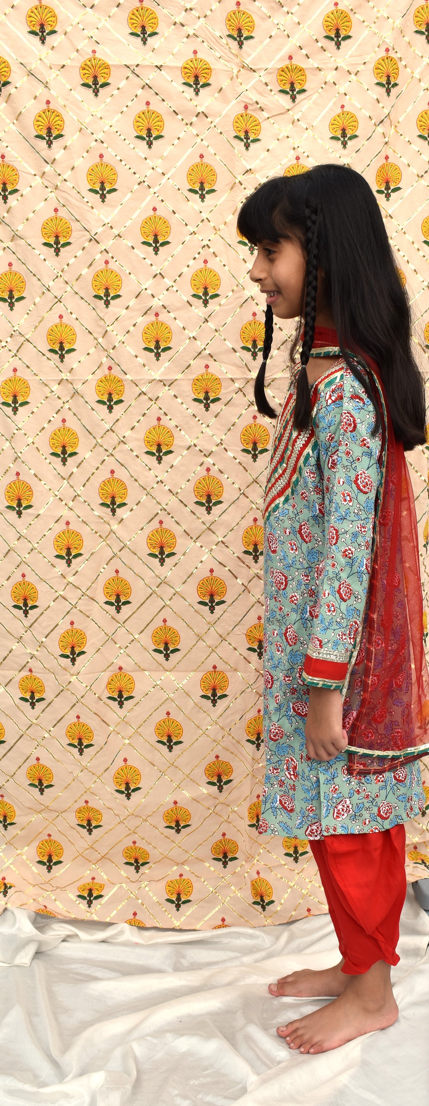 Hara : Green printed kurta with red dhoti and dupatta