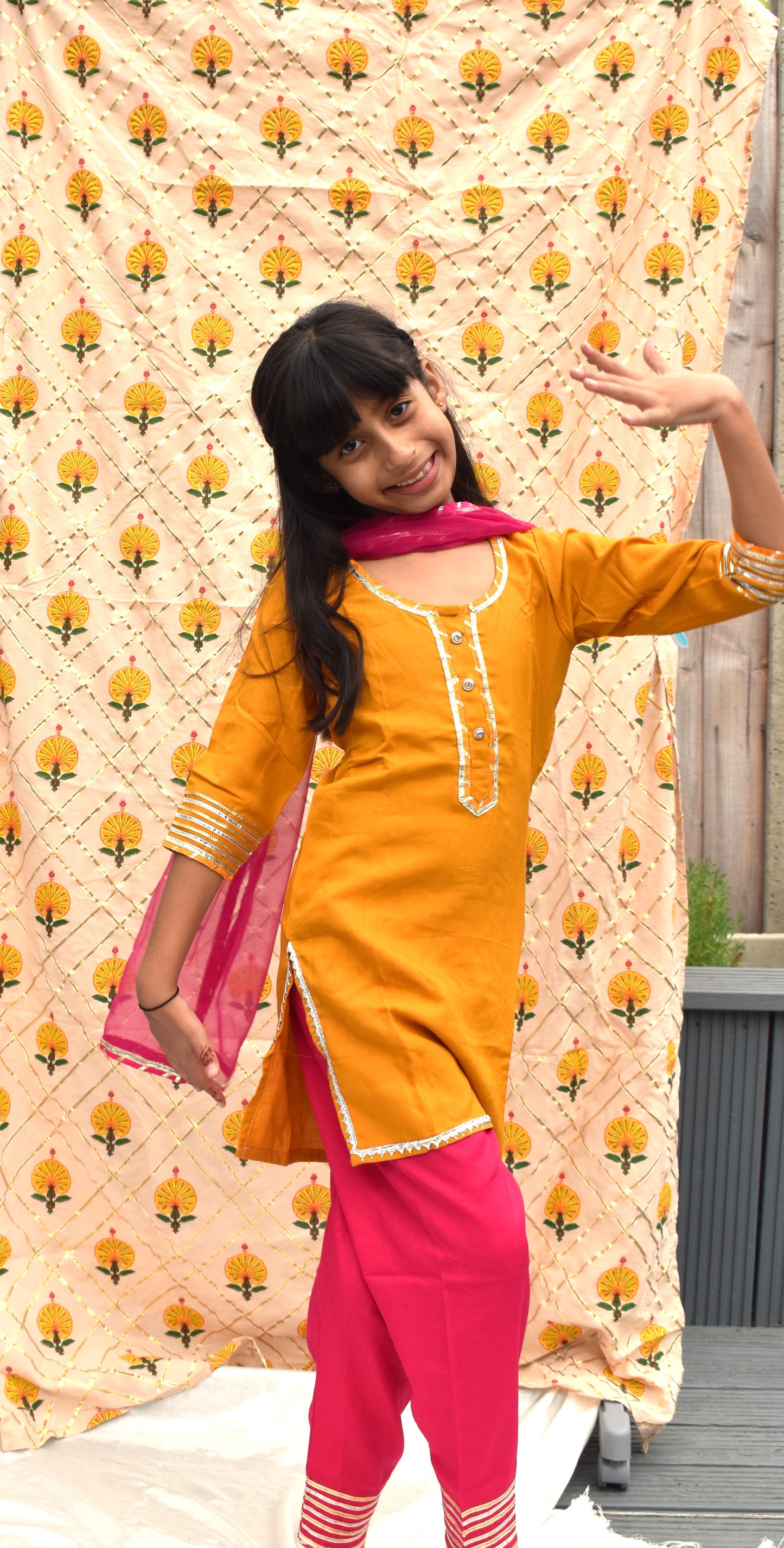 Ira Peel : Yellow kurta with pink pants and dupatta for girls
